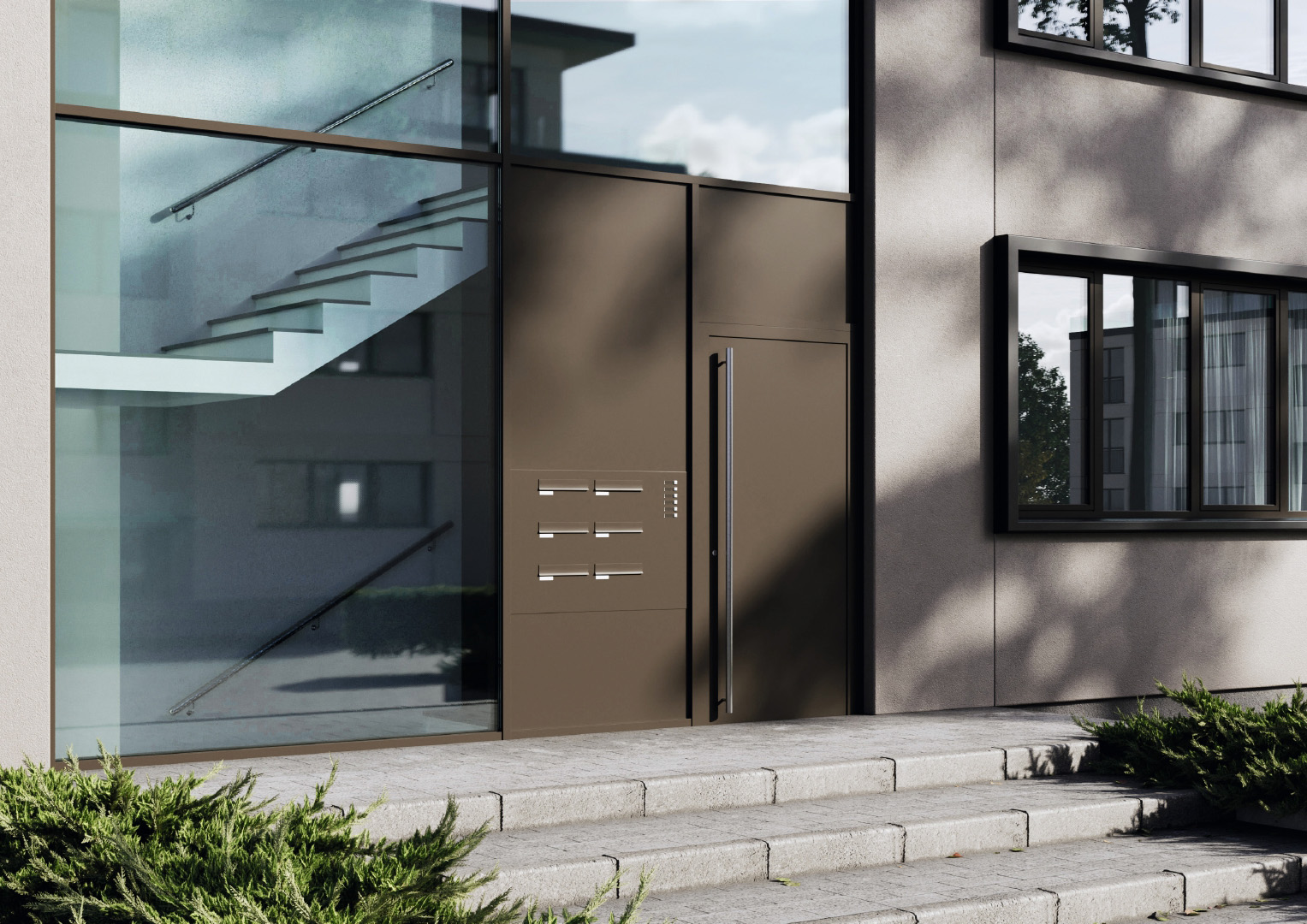 Hauseingang mit moderner Haustür und verglastem Treppenhaus in Mehrfamilienhaus
